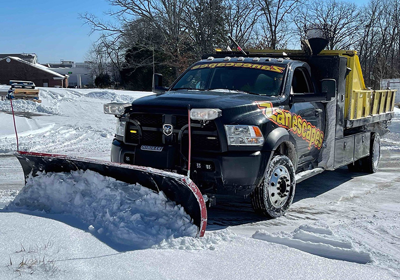snow plow truck removing snow
